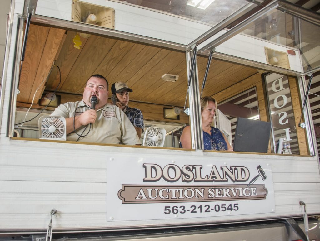 Auctioneer performing services from his camper